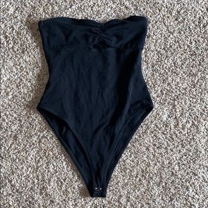 Black tube top body suit